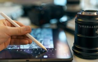 a photographer editing an image on a tablet