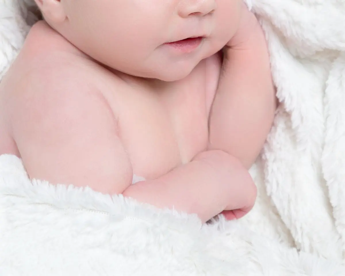 a newborn after skin editing
