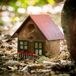 Fairy Photography West Sussex a fairy house on my studio pathway with a red roof