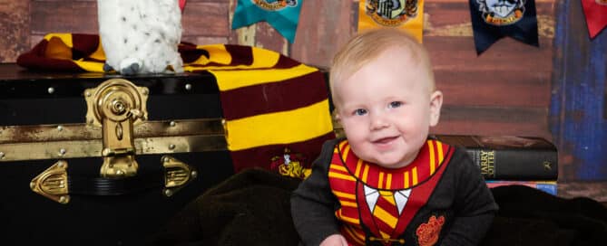 a little boy at a Harry Potter themed professional photo shoot