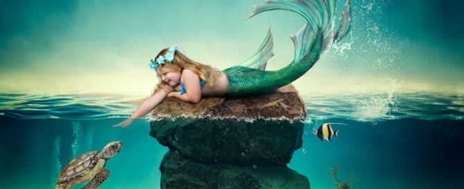 a little girl reaches down to pet a turtle in a digital mermaid artwork