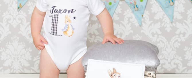 a little boy standing next to a footstool with some Peter Rabbit Props