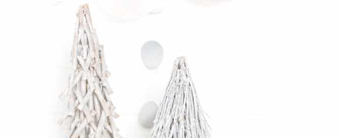 a white and silver festive tree themed set at a Christmas mini photo shoot