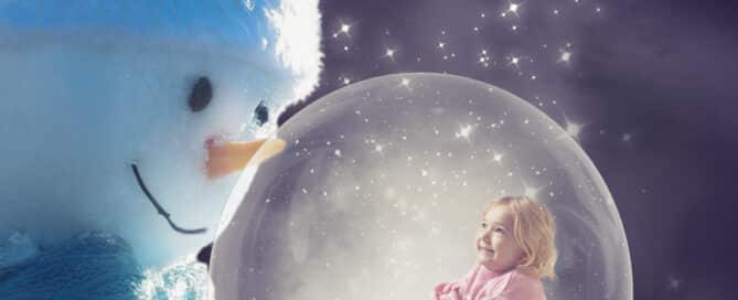 a digital christmas snowglobe featuring a little girl in a globe being held by a snowman