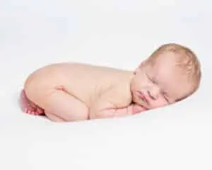 an edited newborn portrait showing flaky skin edited