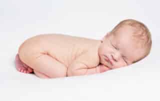 an edited newborn portrait showing flaky skin edited