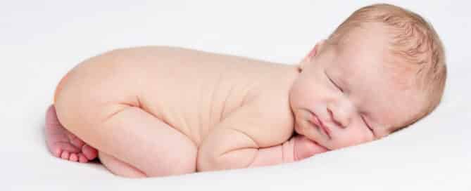 an edited newborn portrait showing flaky skin edited