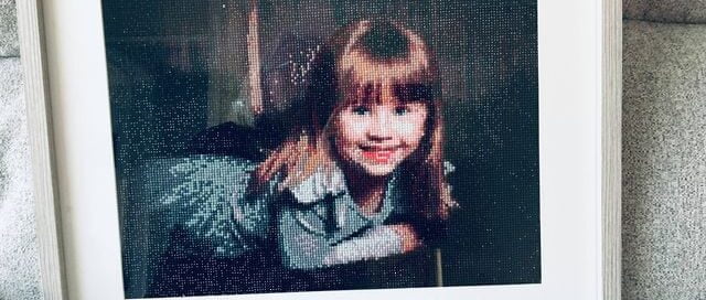 a diamond painting completed of a picture that I took in my studio of a little girl
