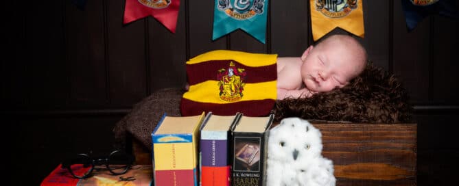 a little boy sleeping in a harry potter themed set