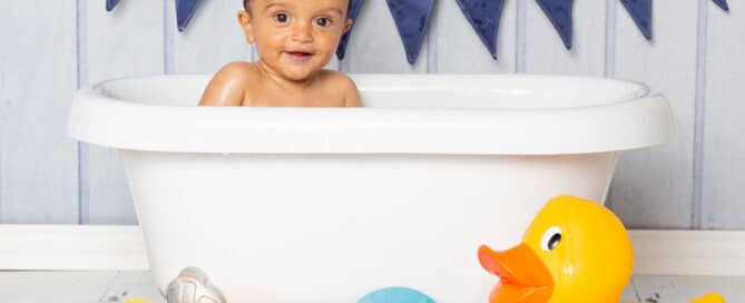 a duck themed tub splash photo shoot with navy accessories