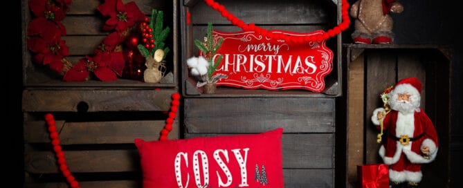 a dark wood set of crates with christmas ornaments make up a festive photo shoot set