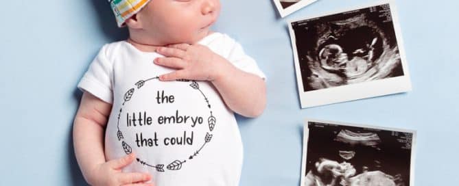 a newborn sleeping next to five scan photos from the ivf process