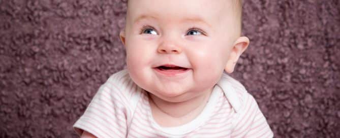 a little girl on a light purple background