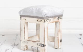 white vintage footstool studio prop