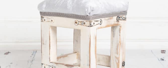 white vintage footstool studio prop