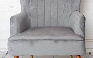 Large grey chair studio prop