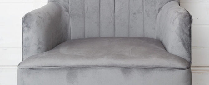 Large grey chair studio prop