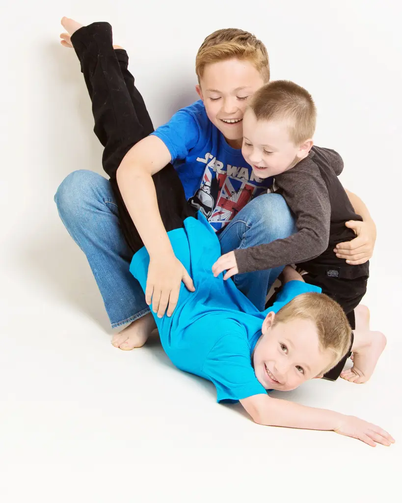 three siblings create a bundle in the photo shoot