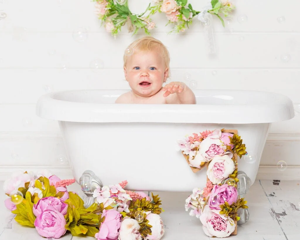 Baby Photography East Grinstead West Sussex a tub splash with my white miniature roll top bath and floral one accessory set