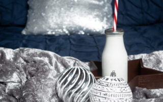 a navy and silver bed themed christmas photo shoot set