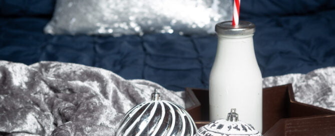 a navy and silver bed themed christmas photo shoot set