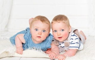 twin boy and girl pose for photos in my studio in East Grinstead