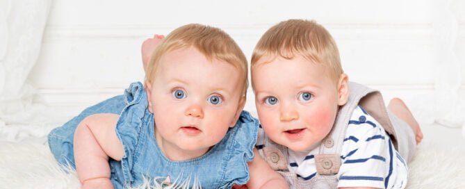 twin boy and girl pose for photos in my studio in East Grinstead