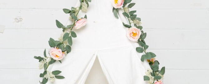 small white tent styled with pink flowers studio prop