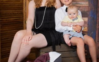A family of four children poses dressed in 1920s outfits