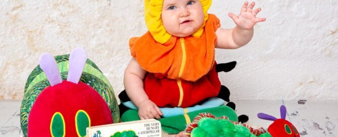 a BABY IN A very hungry caterpillar outift