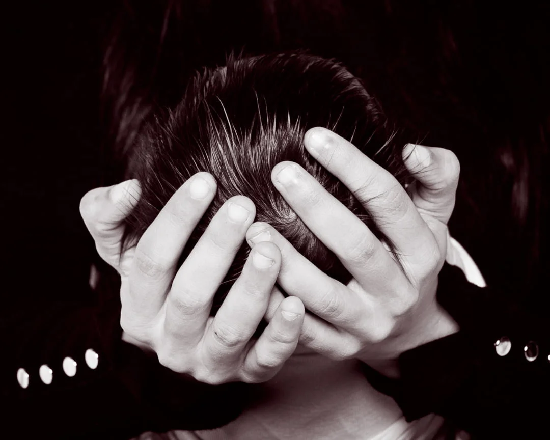 Newborn Photography East Grinstead West Sussex a mother's hands hold a newborn