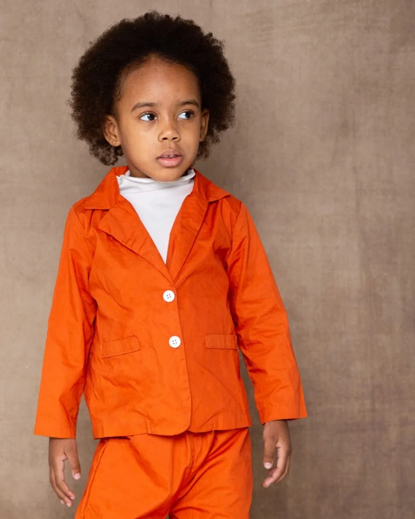 Child Model Actor Head Shots Updates West Sussex a young girl poses in an orange outfit