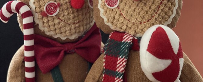 two gingerbread people toys ready for christmas