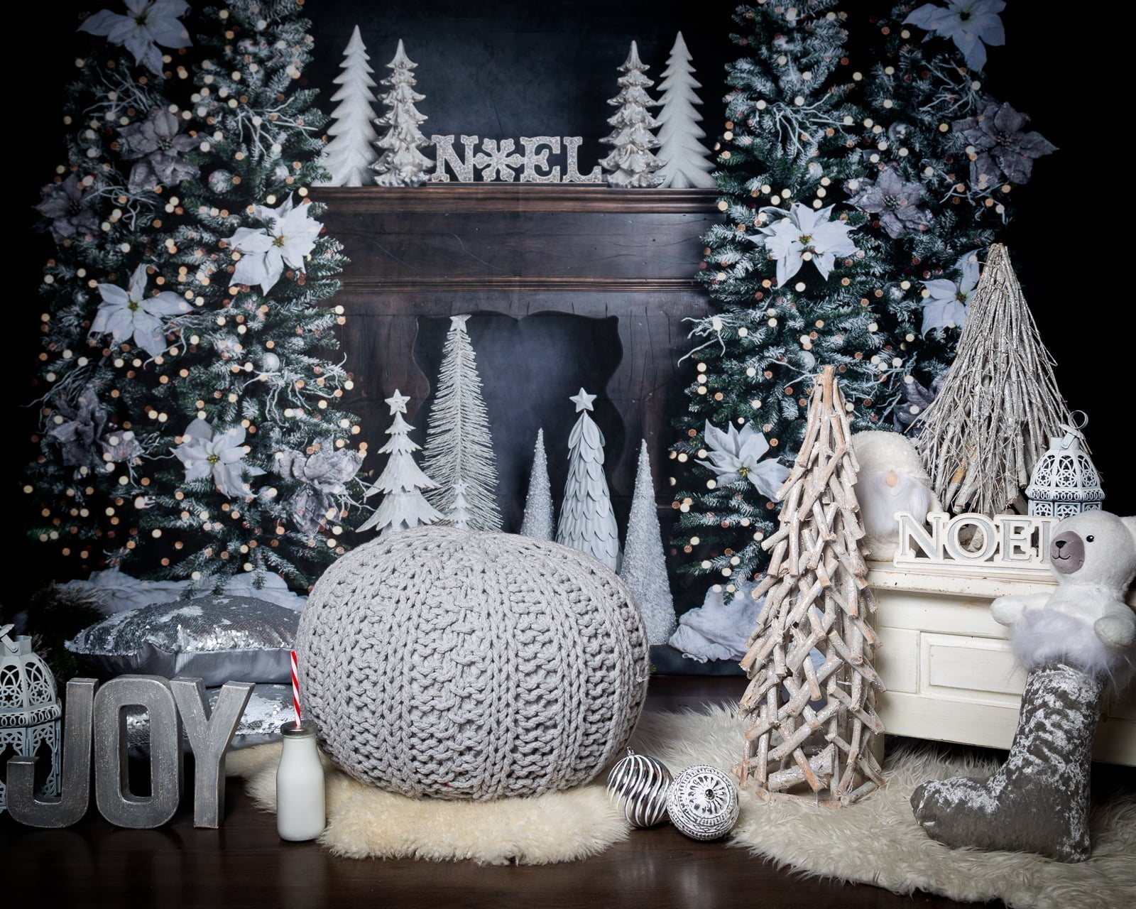 a silver, black and navy themed christmas set featuring a fireplace scene