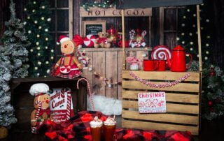 a christmas themed photo shoot set with a hot cocoa stand