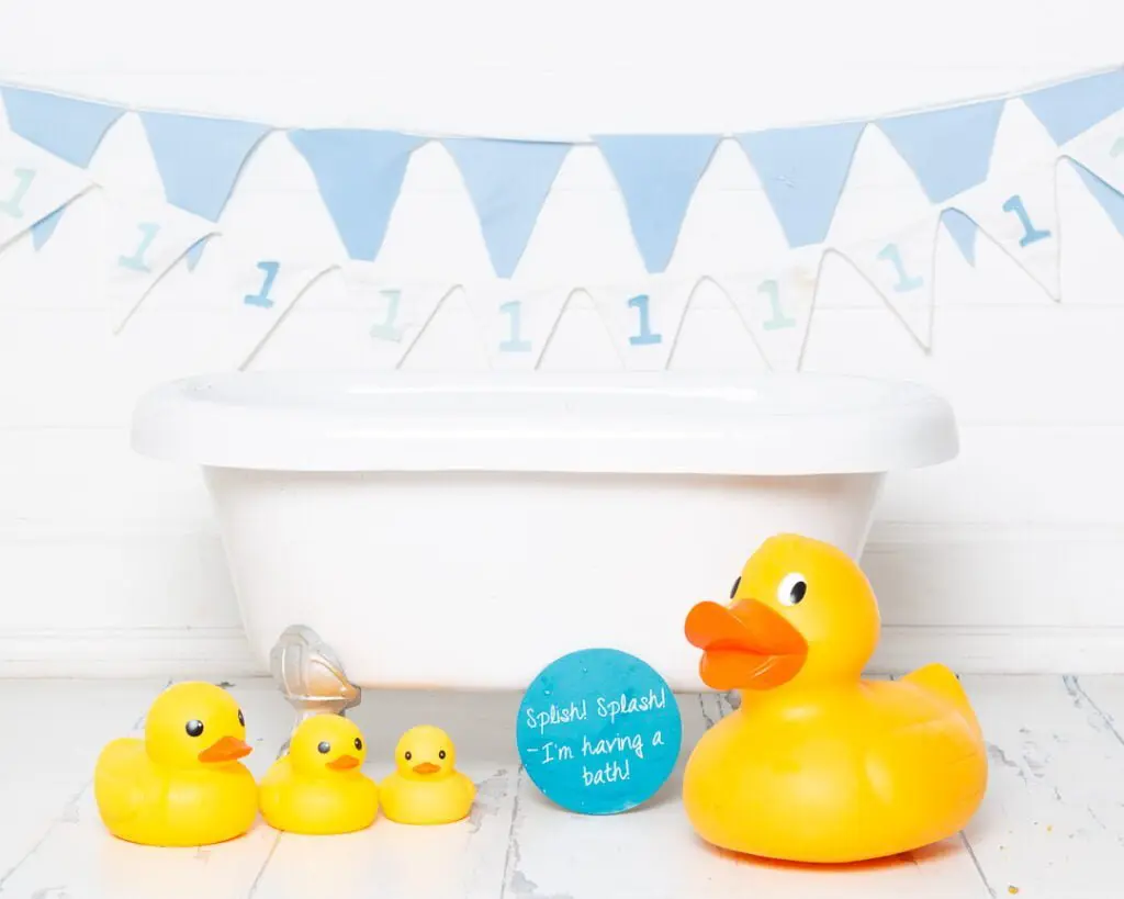 Cake Smash Photo Shoots in East Grinstead West Sussex A white bathtub at a tub splash first birthday photo shoot