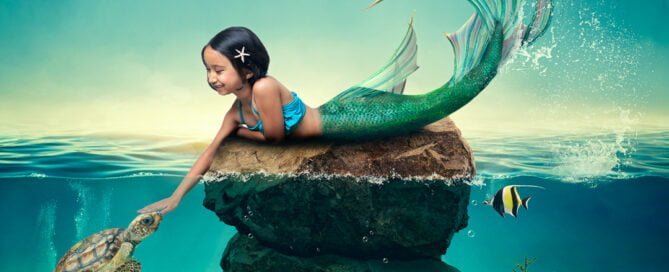 a little girl with dark hair at a mermaid photo shoot