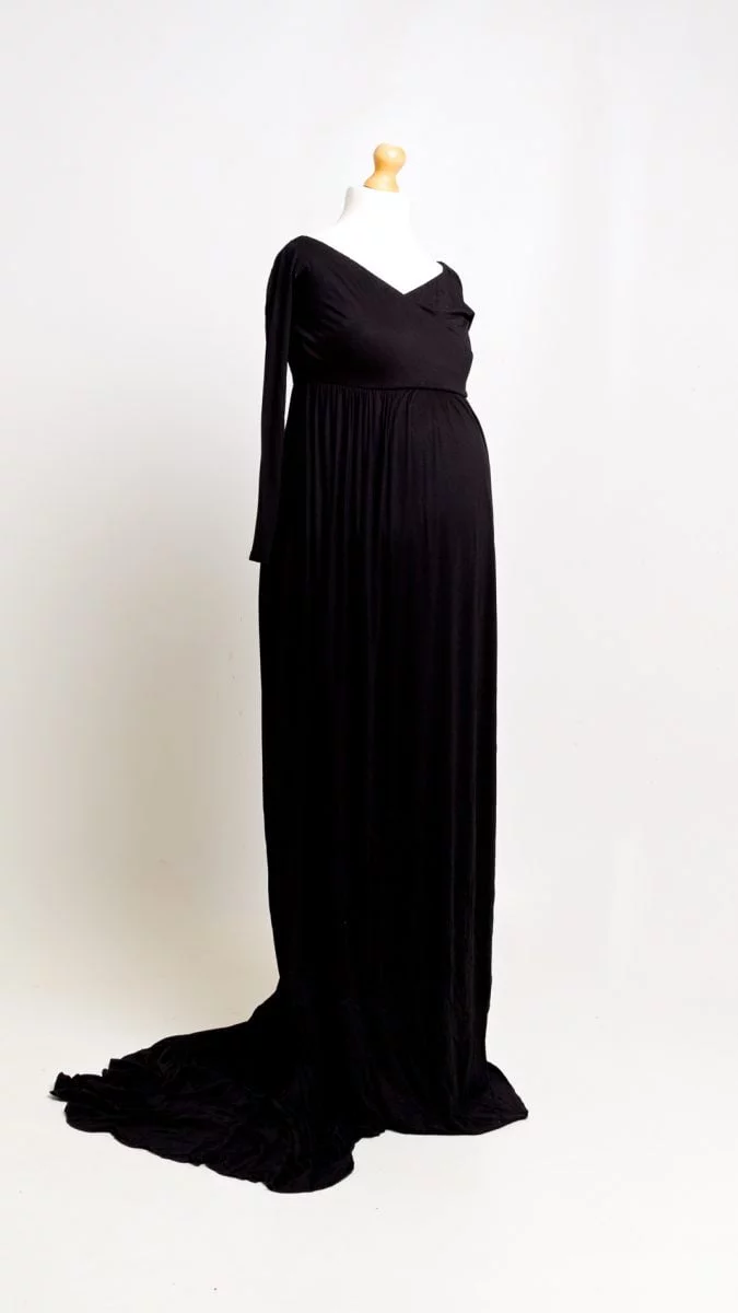 a long black maternity dress on a mannequin