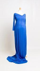 a long blue maternity dress on a mannequin