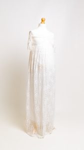 a white lace dress on a mannequin