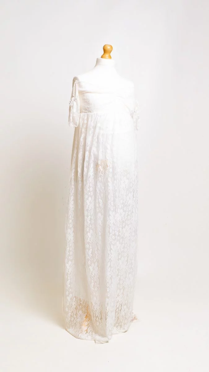 a white lace dress on a mannequin