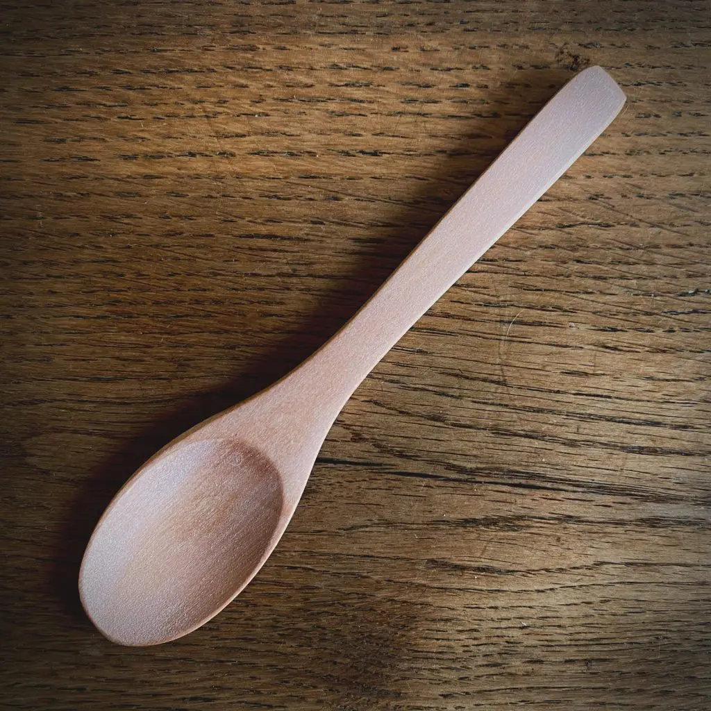 A little wooden spoon used for cake smash photo shoots