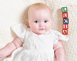 Baby Photography West Sussex a baby with her name spelled out in letter blocks