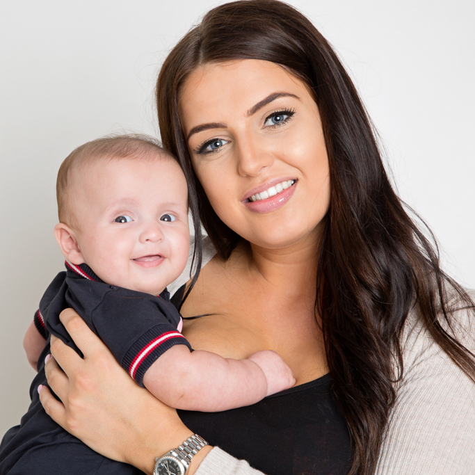 a mum poses with her young son at my photo studio