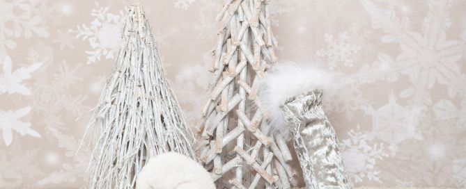 a festive prop set with silver trees and white decorations