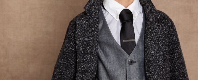 A young boy photographed in a suit in a fine art portrait session