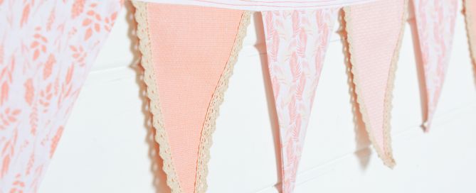 a string of peach bunting finished with vintage style lace