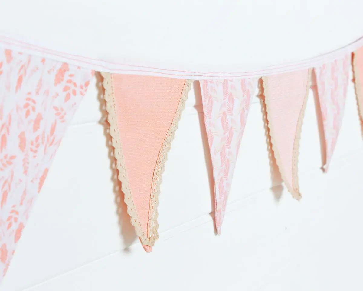 a string of peach bunting finished with vintage style lace