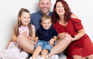 A family laugh at a professional photo shoot