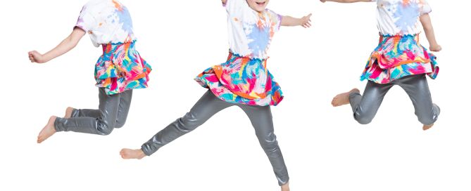 a composite image of a little girl jumping into the air